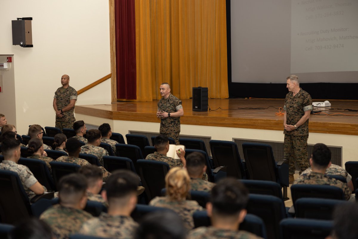 U.S. Marine Corps Recruiting Command leadership speaks to Marines at Camp Kinser, Okinawa, Japan. The purpose of the brief was to provide firsthand knowledge of recruiting duty and expand awareness of the opportunities associated with recruiting to those who are eligible.