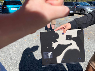 BiolSci_UWA's tweet photo. We’re enjoying the 2023 solar eclipse from the UWA Zoology building - PhD students @jess_hadlow, @MurleyMatilda , @annashortega, and @IsobelSewell   have discovered some creative ways to view the eclipse without equipment! https://t.co/FzUHEos5Ud