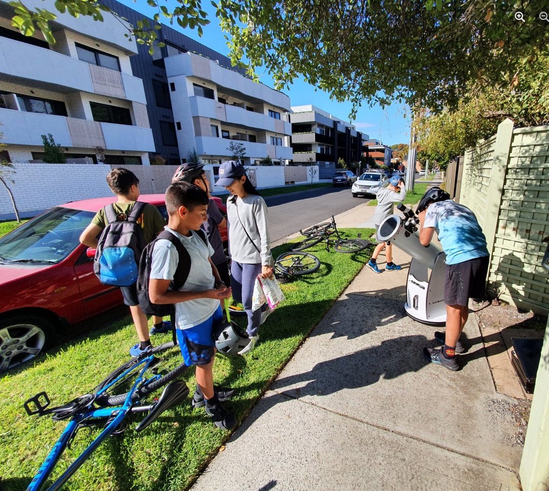 Perryastronomy's tweet photo. Couldn't get to Exmouth for eclipse today, thought I'd share it with passersby outside my house in Melbourne. Got inundated by the curious, managed a quick low quality pic with phone at eyepiece. https://t.co/b5AhUoxVg3