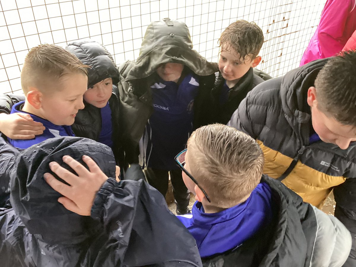Plasnewydd Primary Football team taking part in the recent Caerau Cup football tournament. It was a shame that the weather was not on our side!