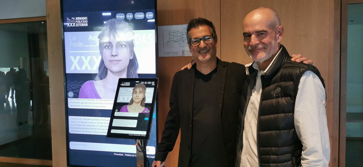 elpublicistacom's tweet photo. En las XXX Jornadas de Publicidad nos recide  Fede, asistente virtual. José Maria Pujol, fundador y CEO de Wetalk_AI, y David Fernández, de Linguistic Factory, creadora del desarrollo y los contenidos, conectado con Gpt #jornadasExterior23 https://t.co/d9cvys0wYJ