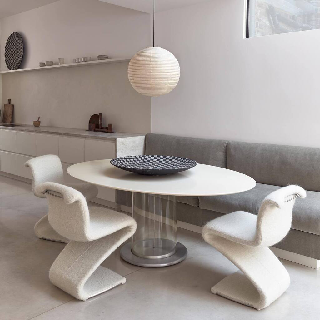 In this Highbury home by <a href="/daytripstudio/">daytrip</a>, we chose to counter the clean-lined kitchen with curvilinear furniture from the @betonbrutlondon collection.

An oval table by Claudio Salocchi reflects rays from the skylight and appears to float on its transpare… instagr.am/p/CrQCv0yv0yV/