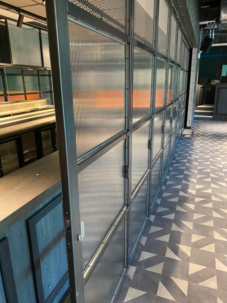createthatedge's tweet photo. A University customer needed a security solution for its bar area but also wanted it to look good, so we designed, manufactured and installed these rolling shutter doors.
#creativeedge #designandbuild #shutterdoors
#projectwork #design https://t.co/16XpSlWInV