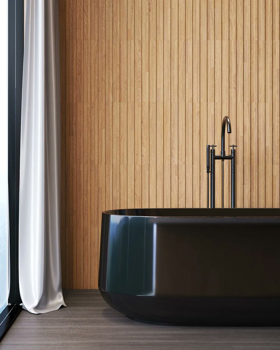 TercotHomes's tweet photo. The black finish on this beautiful freestanding tub provides a modern and sleek look that is accompanied by modest influences through the light wood panelling accent wall. Visit https://t.co/gU0I5XxGGD for more designs you’ll love. #TercotDecorTip #TercotStyle #ModernDesign https://t.co/k42QxotAC3
