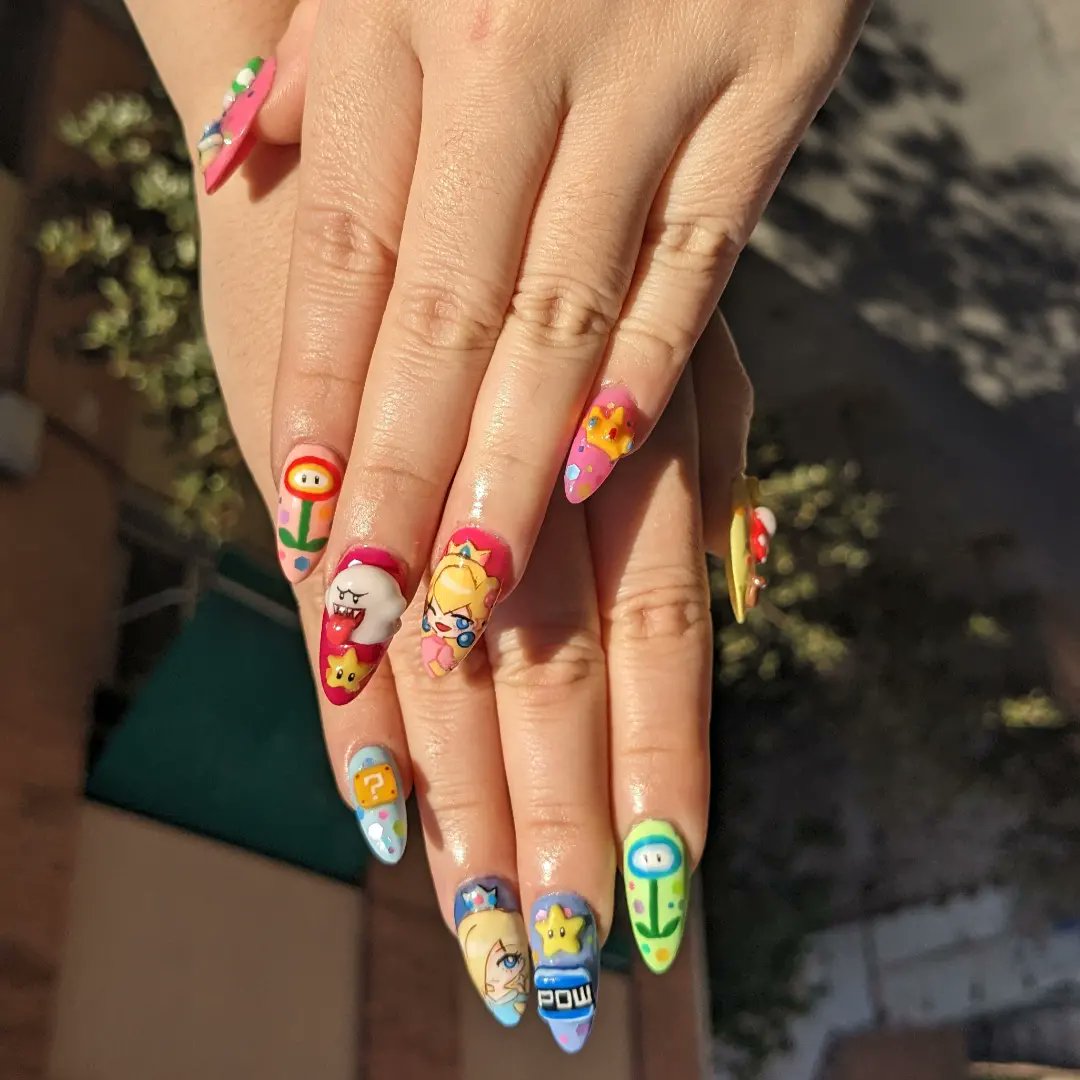 marionshkav's tweet photo. Inspo Nails by insta/dejauwo
Peach and Rosalina by @meowwniz
1week working on this💅
#nails #supermariobros #nailart #gelnails #supermariobrosmovie #videogamenails https://t.co/tNbEIKi7pY