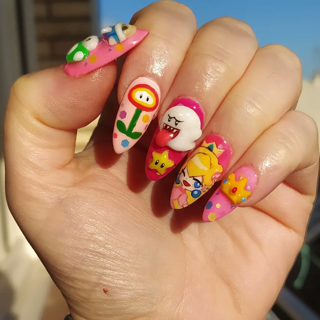 marionshkav's tweet photo. Inspo Nails by insta/dejauwo
Peach and Rosalina by @meowwniz
1week working on this💅
#nails #supermariobros #nailart #gelnails #supermariobrosmovie #videogamenails https://t.co/tNbEIKi7pY
