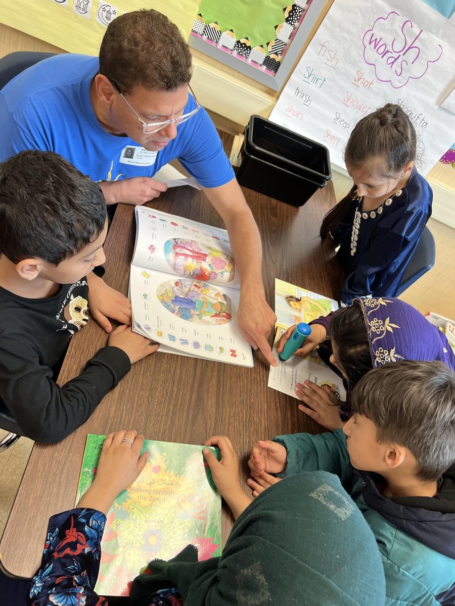 MrsG_bookworm's tweet photo. Yesterday our newcomer students K-5th grade got to explore new classroom books and mantralingual pens that read to them in both English and Pashto! We had volunteers from ASTRA/ALTRUSA come read and introduce the stories to our students! Reading is a blast! @NISDLib @NISDMead https://t.co/33sHyy93uG