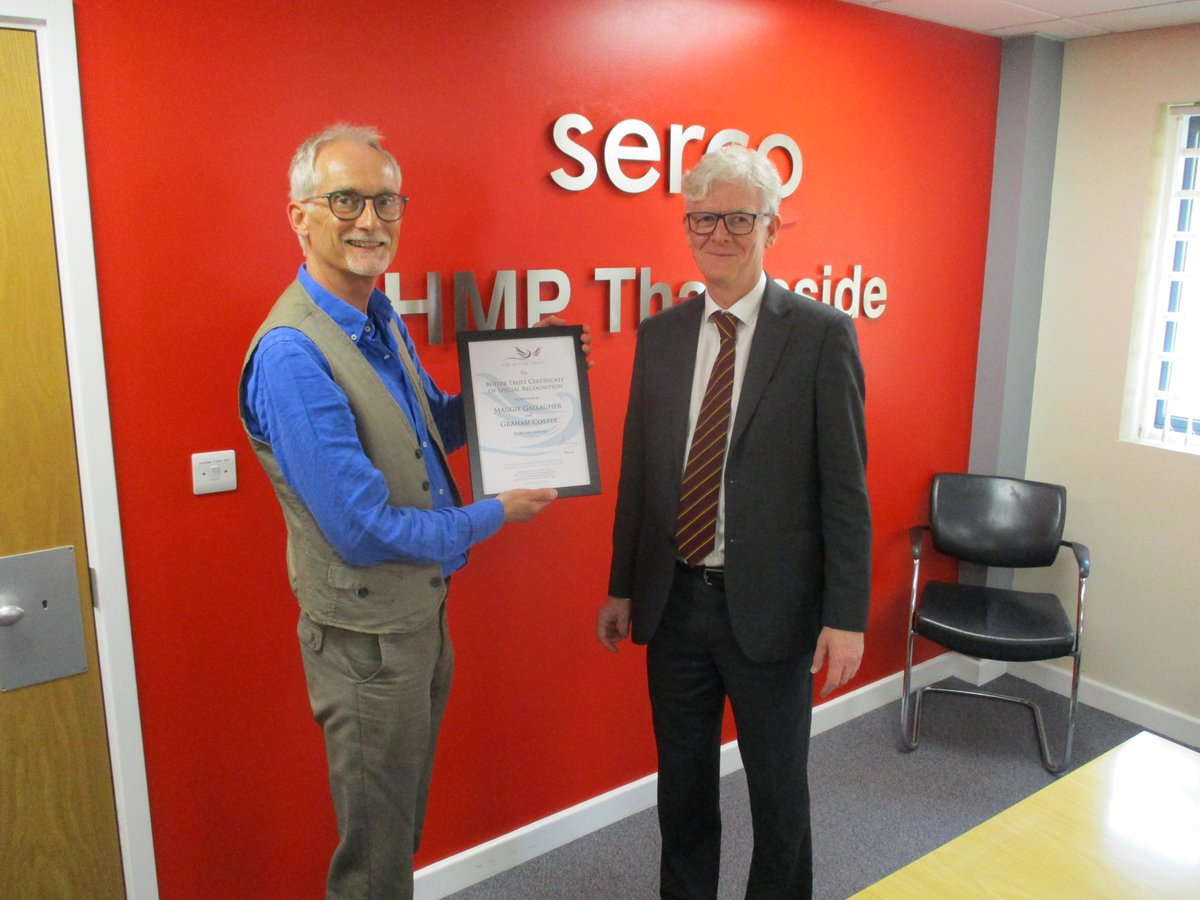 PRG_UK's tweet photo. PRG volunteers Maggie Gallagher &amp; Graham Coster being presented with Certificates of Special Recognition from @ButlerTrust  for their wonderful work over many years with the reading groups at HMP Thameside. Many thanks also to @neil_barclay and the library. #VolunteerDay https://t.co/ECaJDUrYYS