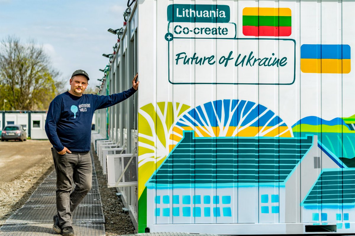 Lithuania's tweet photo. #Ukraine's future is peaceful and optimistic. The mobile settlement built in Borodyanka by 🇱🇹 features 🇺🇦 artists murals and sits next to a school undergoing reconstruction after Russian damage. Life can't wait, people need help now. #CoCreateFutureOfUkraine https://t.co/aQhsPf7fap