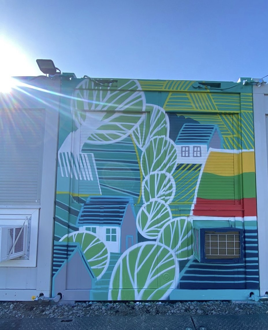 Lithuania's tweet photo. #Ukraine's future is peaceful and optimistic. The mobile settlement built in Borodyanka by 🇱🇹 features 🇺🇦 artists murals and sits next to a school undergoing reconstruction after Russian damage. Life can't wait, people need help now. #CoCreateFutureOfUkraine https://t.co/aQhsPf7fap