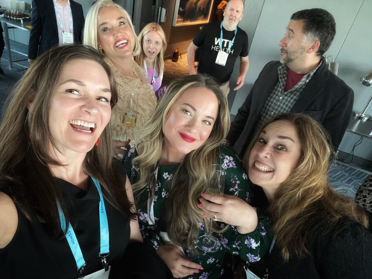 HITeaWithGrace's tweet photo. I was looking back on my pics from this week and there is just so much happening in this photo 😂 @boltyboy @ThomasNOV @katmcdavitt @IngaHealthIT and a girl dressed up in glasses of champagne handing out glasses of champagne #HIMSS23 https://t.co/gvhV89kSdZ