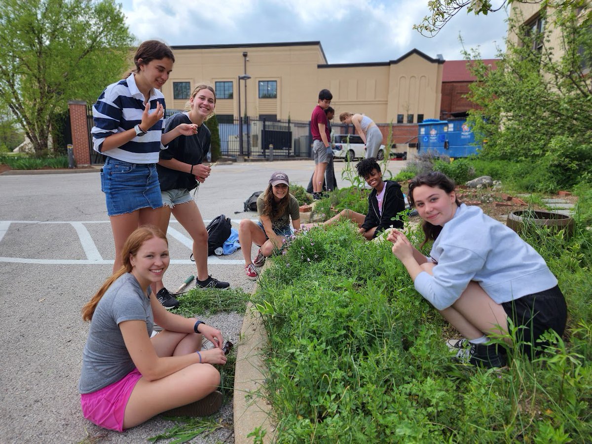 Ms. Patterson's gardening class was spotted on campus this afternoon pulling weeds & garlic/onion grass to make room for a new herb garden.