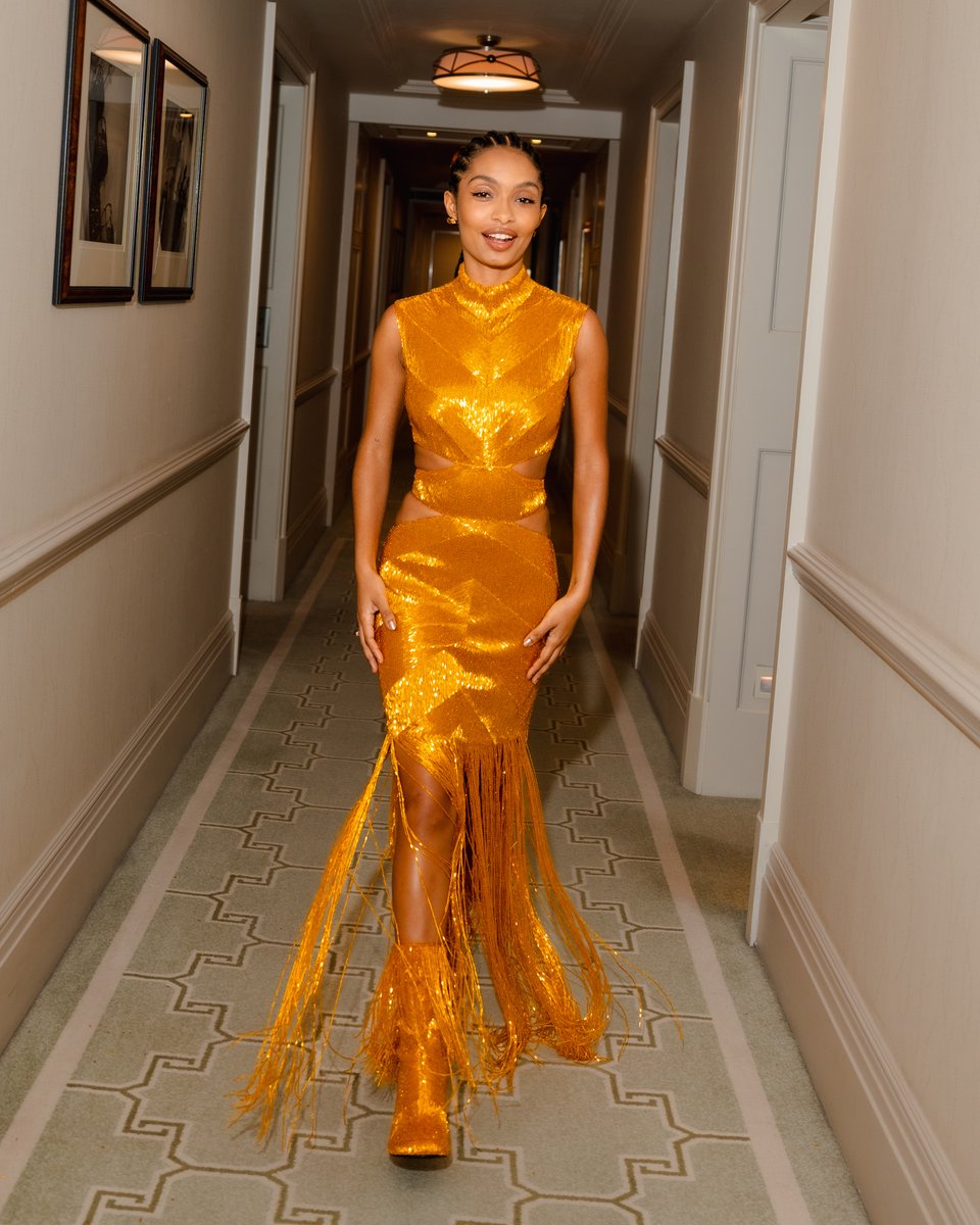 McQueen's tweet photo. Captured ahead of the #PeterPanAndWendy World Premiere, #YaraShahidi is #SeenInMcQueen wearing a slashed dress and pin heel boots with yellow all-over bugle bead embroidery and fringing. https://t.co/HT3byI3EpV
