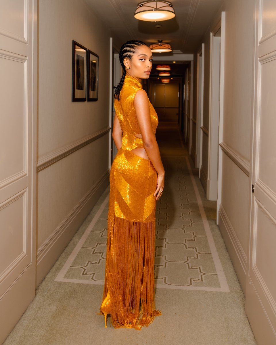 McQueen's tweet photo. Captured ahead of the #PeterPanAndWendy World Premiere, #YaraShahidi is #SeenInMcQueen wearing a slashed dress and pin heel boots with yellow all-over bugle bead embroidery and fringing. https://t.co/HT3byI3EpV