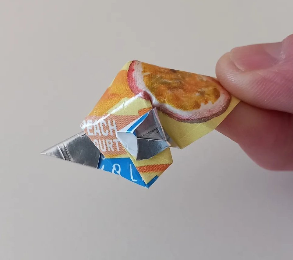 MattBookbinding's tweet photo. Yogurt Lid Bird Head. Designed and folded by me. I keep making these, usually a little different each time. You need good locking folds. #origami #origamibird #origamiyogurtlid #recycledorigami https://t.co/TOIe6vE7WO