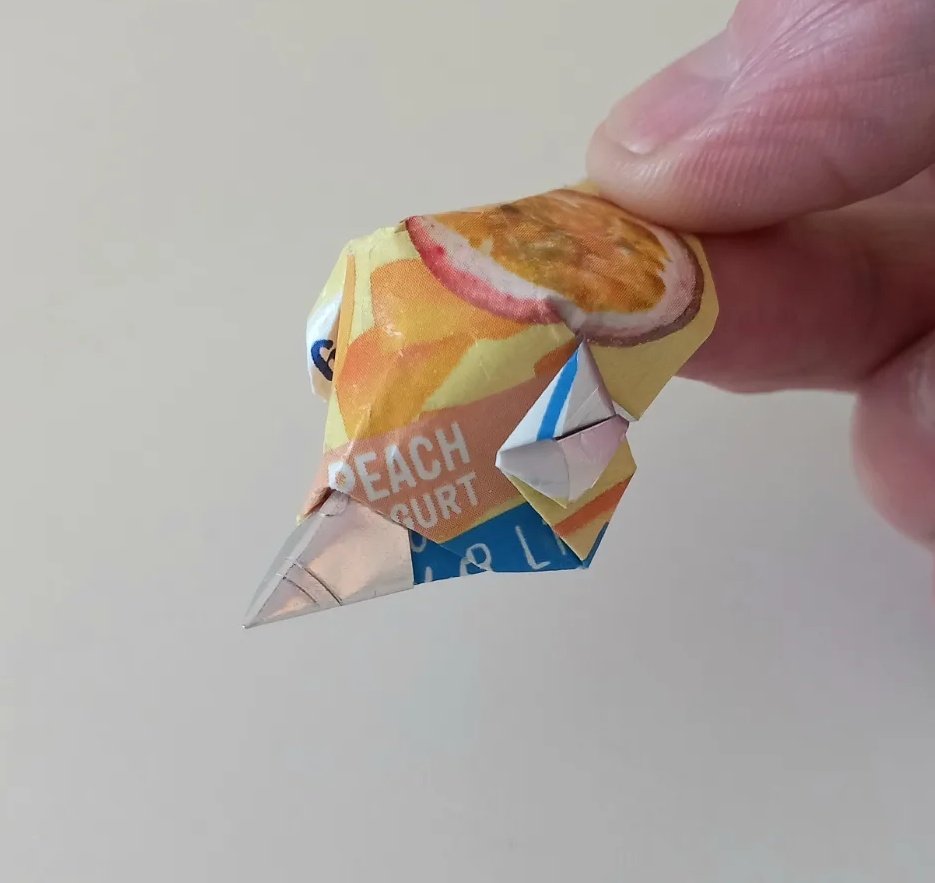 MattBookbinding's tweet photo. Yogurt Lid Bird Head. Designed and folded by me. I keep making these, usually a little different each time. You need good locking folds. #origami #origamibird #origamiyogurtlid #recycledorigami https://t.co/TOIe6vE7WO
