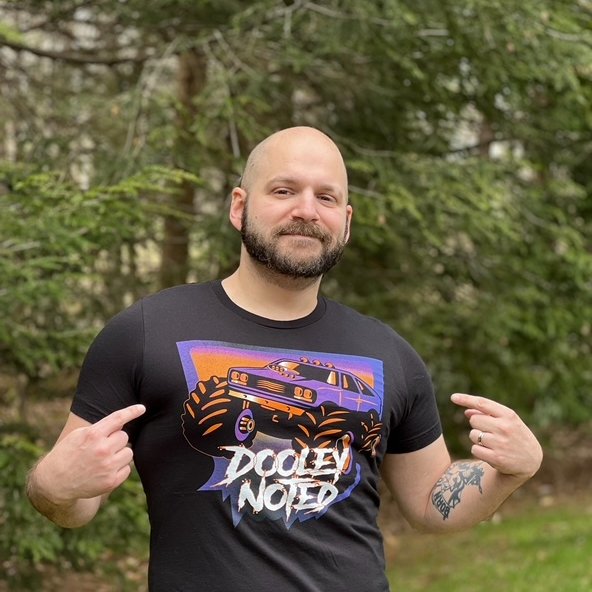 JeremyNDooley's tweet photo. Merch is finally here! You can head to https://t.co/Ta1GYtfiMT to pick up any or all of these 4 shirts! Whether you want to represent Dooley Noted, rock on with 1551,  keep it classy with Noted, or sport my 5 cats with the Campfire Cats, there's something for you! Thank you! 💜🧡 https://t.co/TQwpGgNlAk