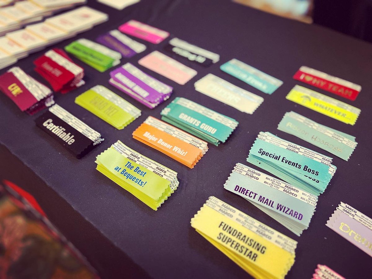 UinvitedU's tweet photo. Day 3 at #CAGP23 - ribbon dork-status defcon-3: Ridiculous 

Thank you @CFRE_INTL for bringing UNsanctioned FABULOUS ribbons to conferences. I don’t want peers to think they = power or importance.

We created them for belonging, but should never take ourselves too seriously 🤓 https://t.co/gloqoliokY