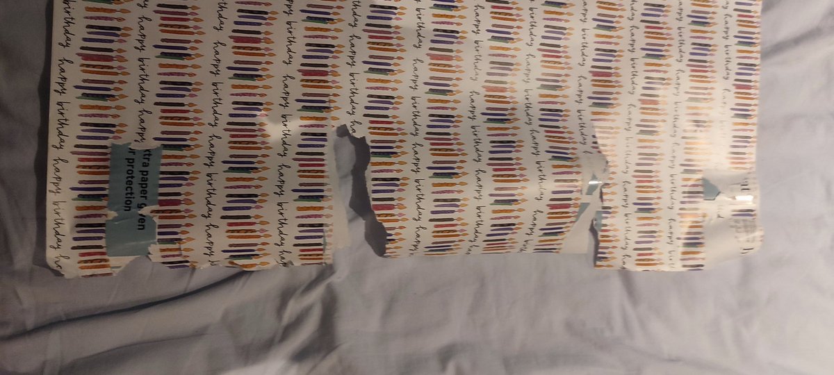 PaoloCanonica's tweet photo. @habitat has decided that to be environmentally friendly they would replace plastic wrapping around a tube of wrapping paper with sticky paper tabs. This is the result when you open it. 30cm of wrapping paper ruined. Does that offset the effect of removing the plastic? https://t.co/UKsuJU48Z0