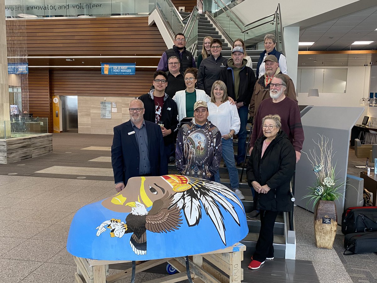 JaceMaki's tweet photo. Today @synergycu unveiled their portion of the public art project Faces of Lloydminster. Over a dozen 300 pound cement faces have been painted by local artists and will be displayed around the community! #yll #yllart https://t.co/spfwQhPWWI