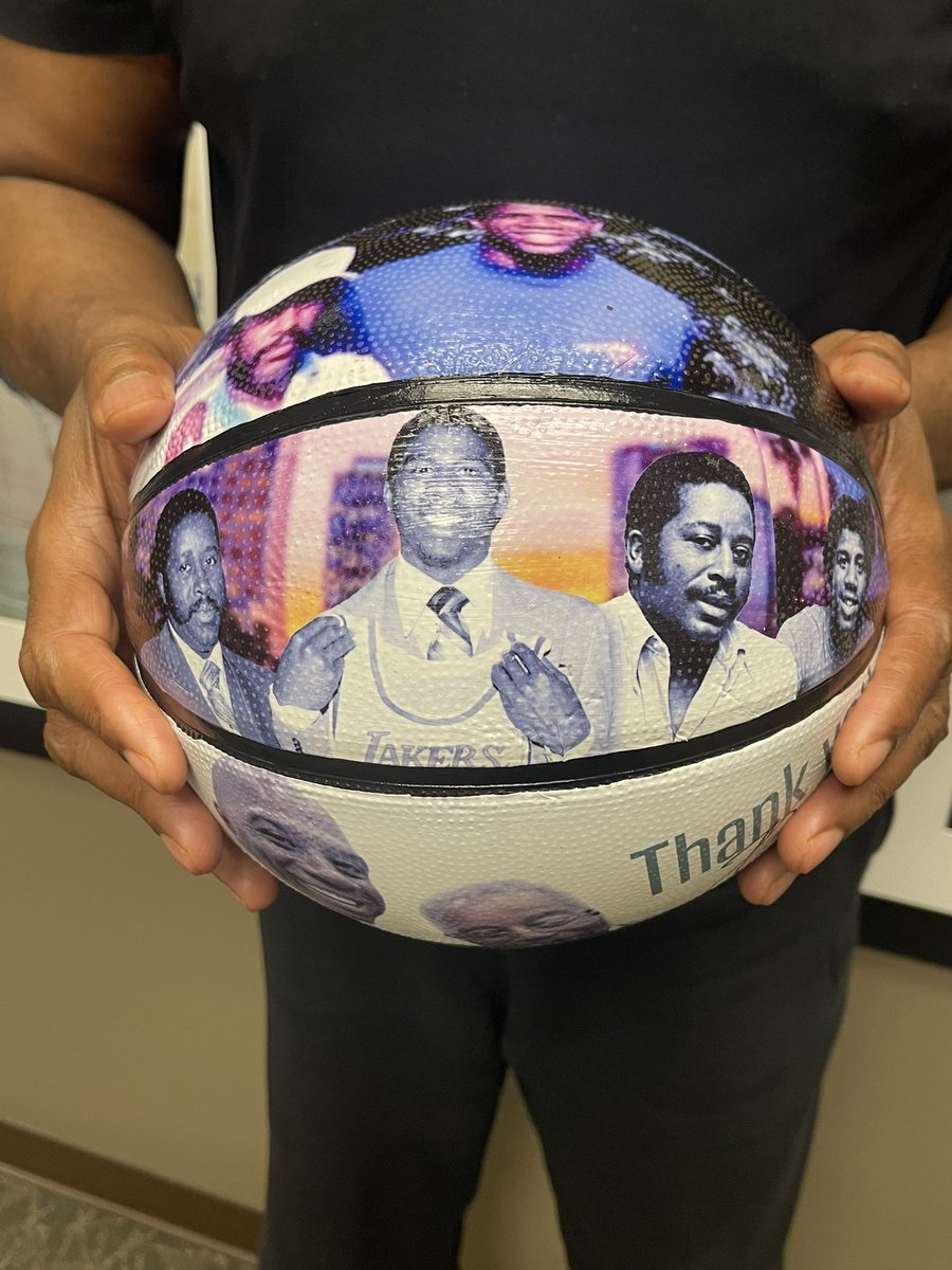 MagicJohnson's tweet photo. I want to send a special thank you to artist Brittany Baham for creating this incredible basketball in memory of my father! 💚🤍 @BahamMultimedia https://t.co/VtH1ZqRmx8