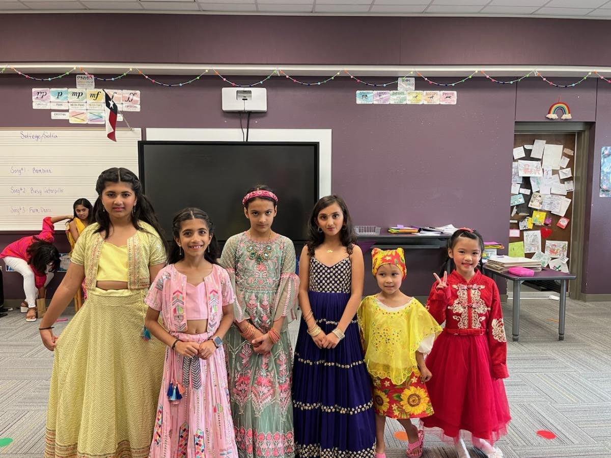 KeleyWilton's tweet photo. Family Heritage Night 🌎 
Fashion Show, Talent Show, and Prosper High School Steel Drums
Students loved visiting all the countries and stamping their passports tonight!
#WREourheritage
#WindsongStrong
#ProsperProud https://t.co/1WMSHwCkD7