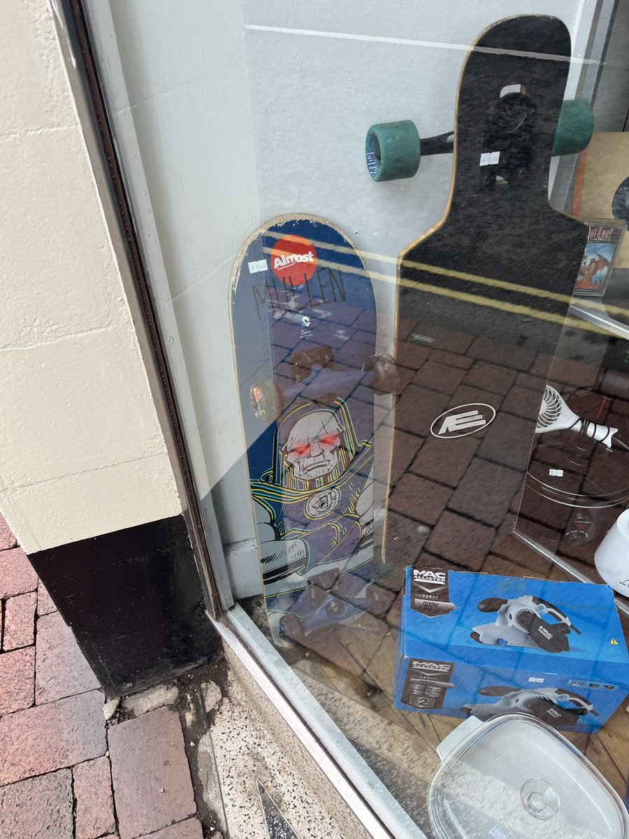 JonathanCarfrae's tweet photo. Long Sutton charity shop windows are special. Containing (but not limited to) a Rodney Mullen signature model and Metallica’s phenomenal 2003 release, St. Anger. https://t.co/jGHk883Tuk