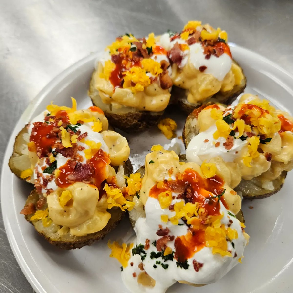coach_jacobson's tweet photo. We had some extra russet potatoes, so for lab on Wednesday, Culinary 2 made some Loaded Mac and Cheese Stuffed Potatoes! This was a first time recipe and was a big winner! 😋 @wilmotuhs #InspiredByWilmot #stuffedpotato #macandcheesepotato https://t.co/crSy4EKS3p