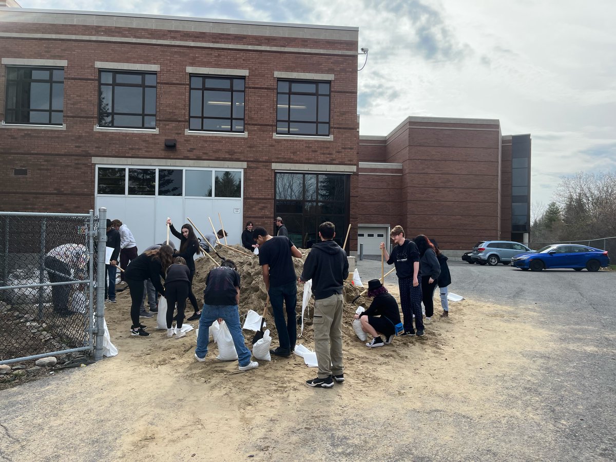 AllSaintsOCSB's tweet photo. We are busy packing sand bags to help with house flooding in our rural community. Thanks to our staff and students who organized three truck loads of sand and are doing the heavy lifting on packing those bags for families who need relief! #ocsb https://t.co/5A4swvvZzU
