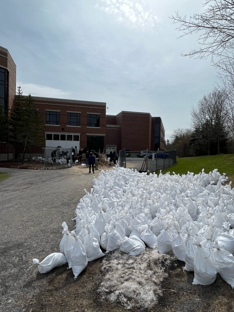 AllSaintsOCSB's tweet photo. We are busy packing sand bags to help with house flooding in our rural community. Thanks to our staff and students who organized three truck loads of sand and are doing the heavy lifting on packing those bags for families who need relief! #ocsb https://t.co/5A4swvvZzU
