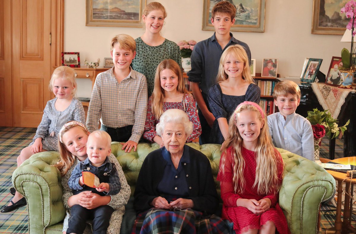 On what would have been her 97th birthday, Queen Elizabeth II is pictured with two of her grandchildren and eight of her great grandchildren in this touching photograph taken by the Princess of Wales at Balmoral last summer.