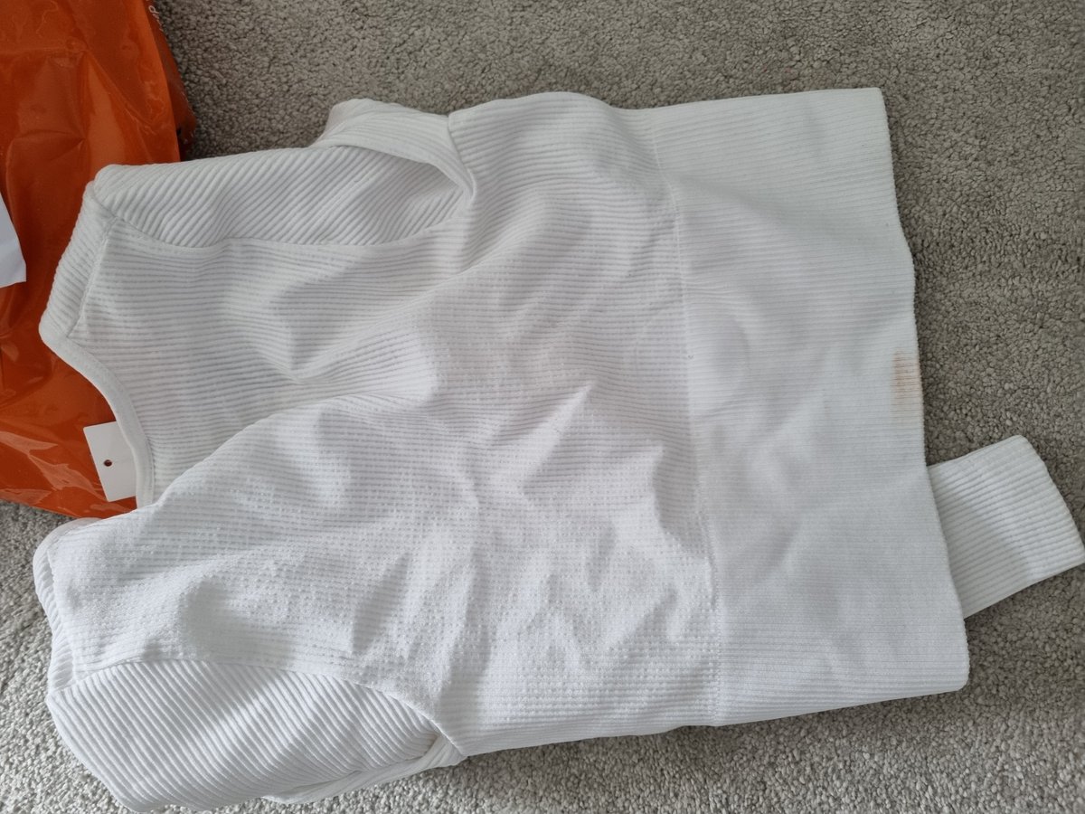 EmmaTate2's tweet photo. @UrbanOutfitters Absolutely disgusting ordered a top online only to pick it up from instore and receive it in this state, looks like it's been worn and kicked around a floor with makeup on? Nice quality control  #urbanoutfitters #grim https://t.co/dQtDkhAuS4