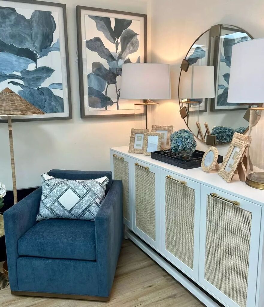 Upgrade your interior with modern style! 🤩 Our Macon Buffet Cabinet is on trend for good reason with it's cane door fronts and nickel hardware. We complimented this piece with tasteful rattan accessories and a striking dark blue accent chair.

#pineapplegirlsjupiter #interio…