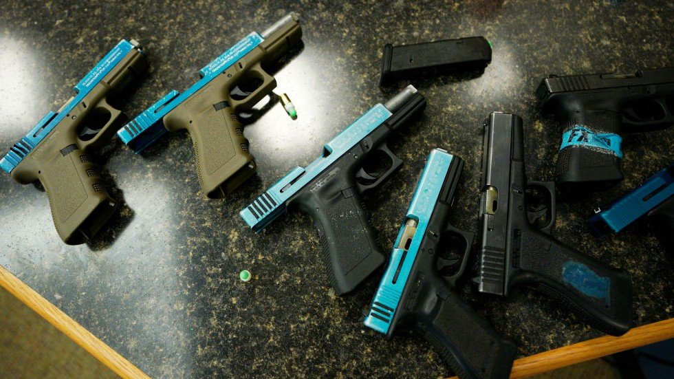 thehill's tweet photo. Indiana Gov. Holcomb signs bill making machine gun "switch" illegal https://t.co/rIGU3KheSr https://t.co/yEQdhVQ382