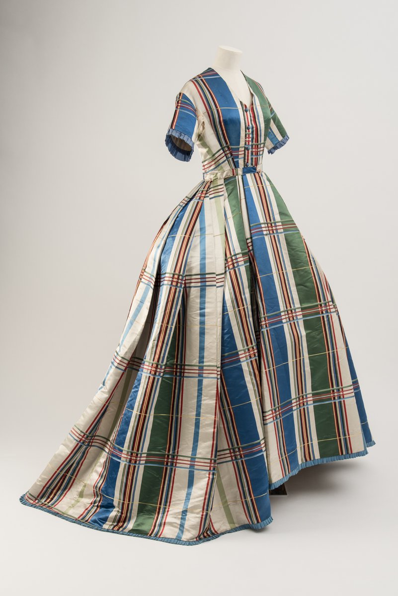 Fashion_Museum's tweet image. Friday Treat Time and a stunning silk satin day dress with tartan design from the 1860s. Bold and beautiful, this striking checked gown is currently on loan to @VADundee and can be seen on display in their fantastic new #Tartan exhibition until 14 January 2024 #VADTartan