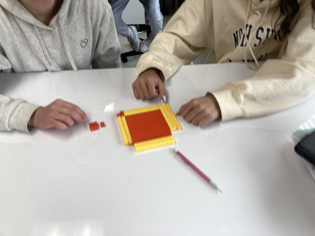 Students used algebra tiles to visually see what it means to complete the square.