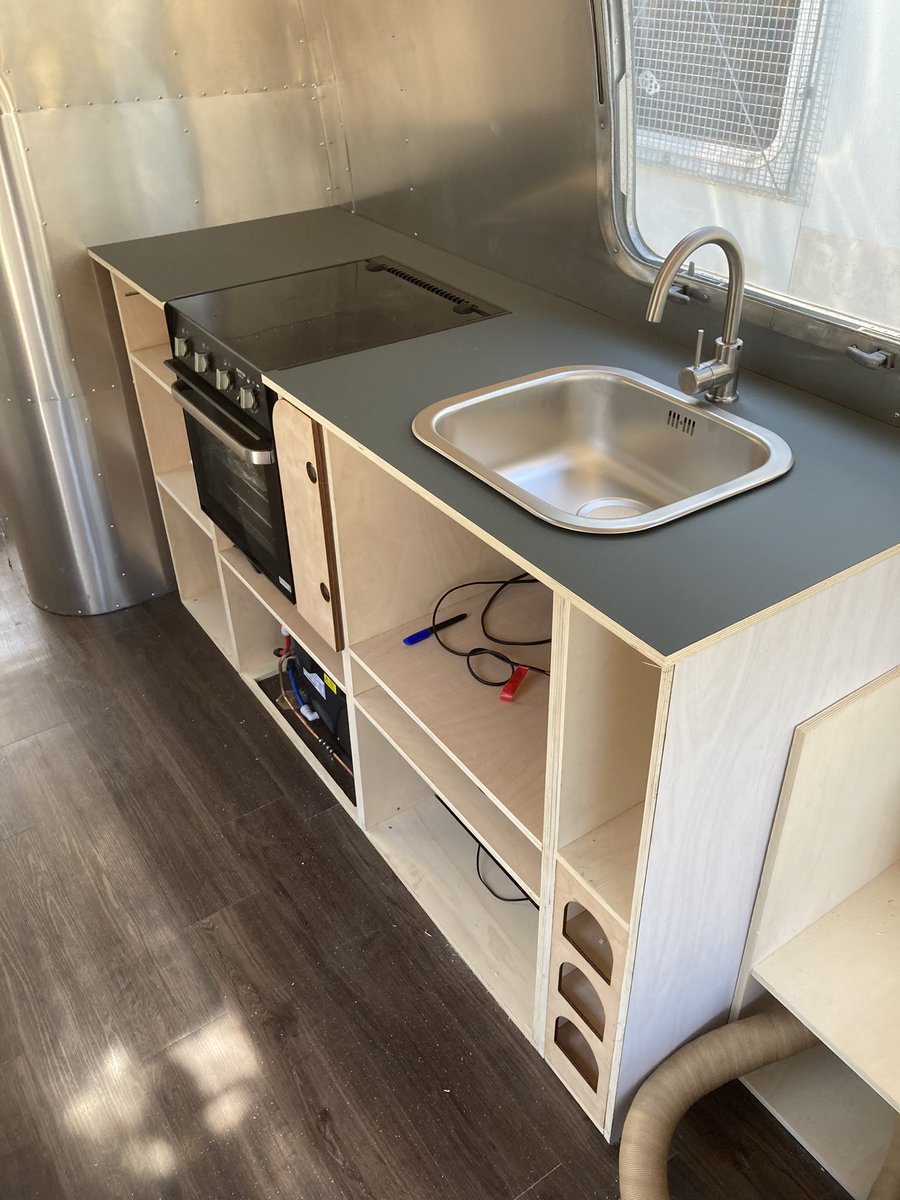 madewhitstable's tweet photo. Worktops in, bed finished, doors going on and the curved cabinet is nearly complete- just the control panel to wire up #airstream #bespoke https://t.co/dLLBnM2WZo
