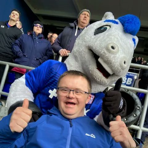 LeadingLives's tweet photo. One of our #SupportToLiveAtHome customers enjoyed a day out attending an @IpswichTown match with a special visit from Town mascot Bluey! He enjoyed the game and said "It made me very happy, especially meeting Bluey and Ipswich winning!" #SocialCare #LeadTheLifeYouChoose #ITFC https://t.co/NJT71J2i6t