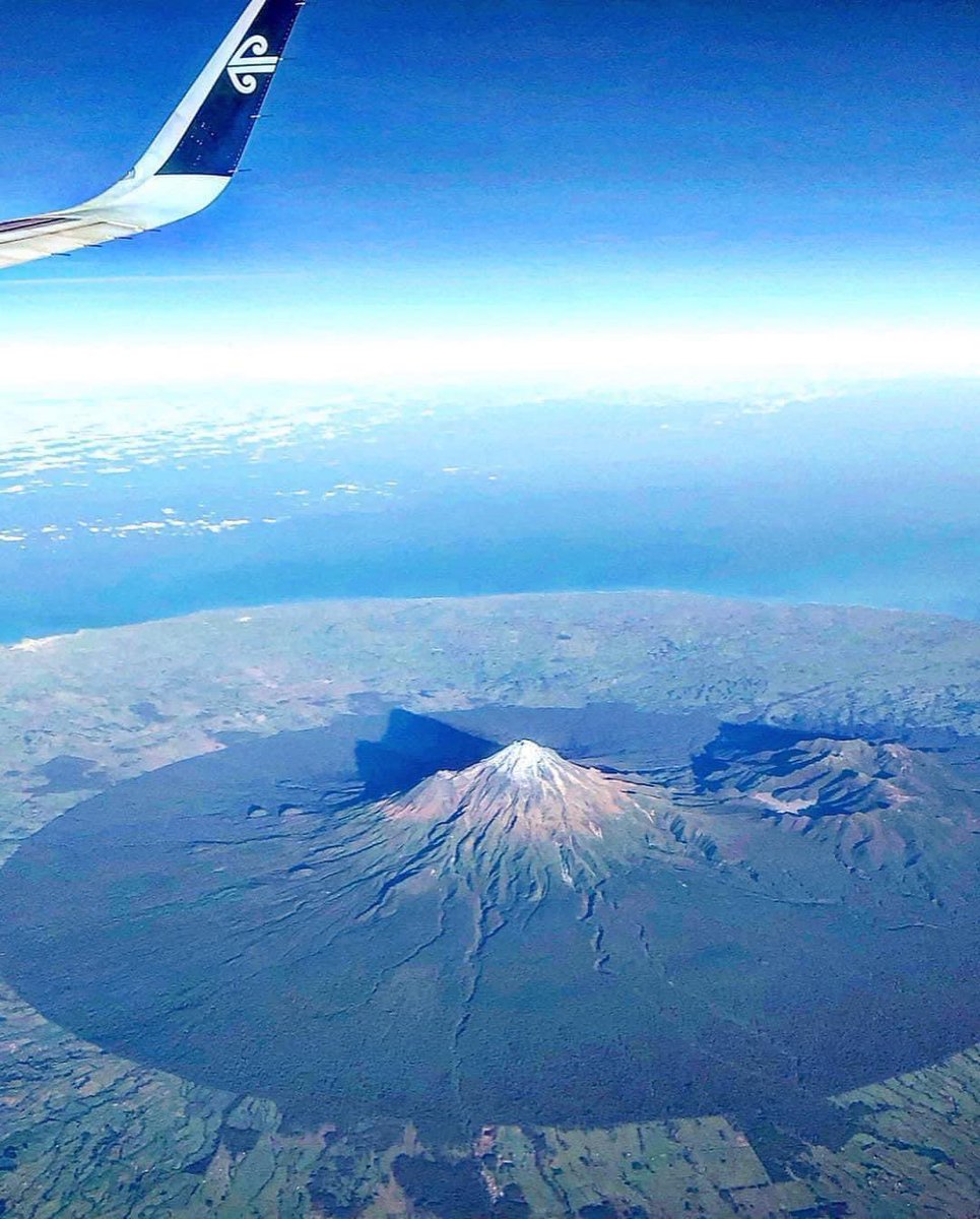 Wow ! View of Taranaki region on the west coast of New Zealand, flying over Mount Taranaki. A dormant, stratovolcano. To capture this must be so satisfying especially on a clear day . Credit - Vikki Gibson #geography #geographyteacher