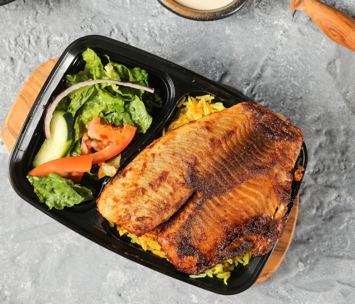 Healthy and delicious lunches like this tilapia rice platter are waiting for you on the NWKD app.

Learn how ordering lunch on the app helps feed a #Newark resident in need: newarkworkingkitchens.com  

📸: <a href="/PitaSquare/">Pita square</a>