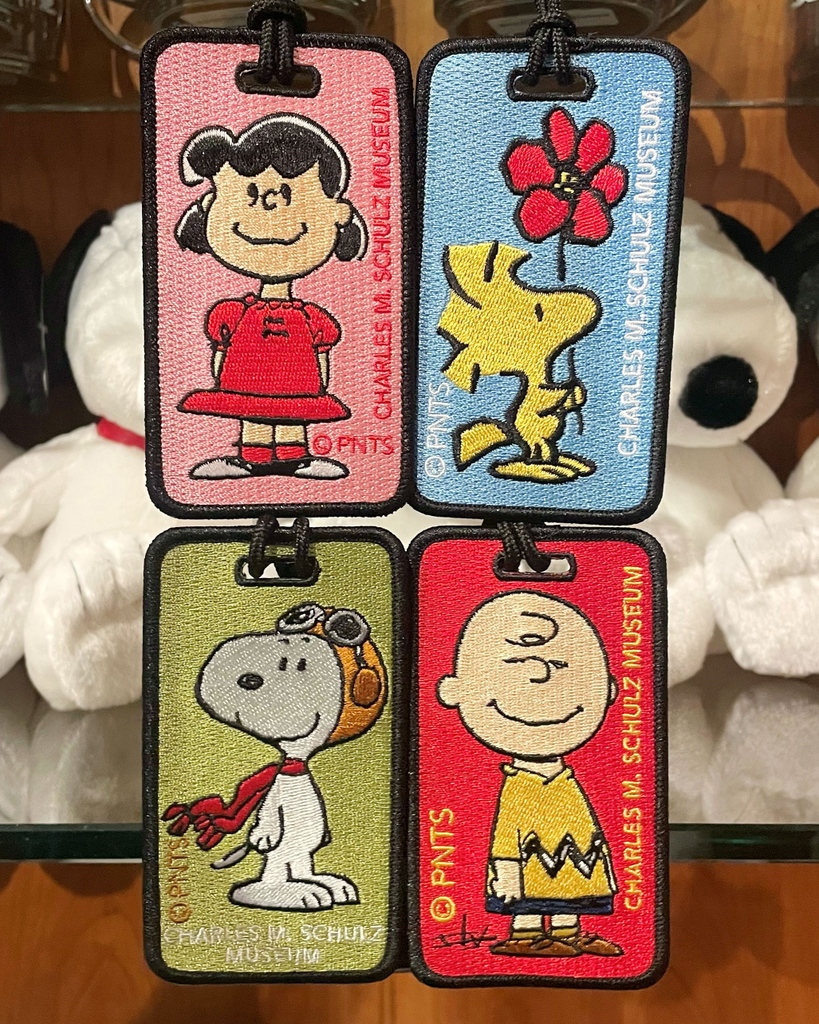 ✈️ Ready to jet off to your next adventure? Make sure your luggage is summer-ready with our stylish Peanuts luggage tags!⁠ ⁠ 🔗 Purchase on your next visit to the Museum or from our Online Museum Store: schulzmuseum.org/shop