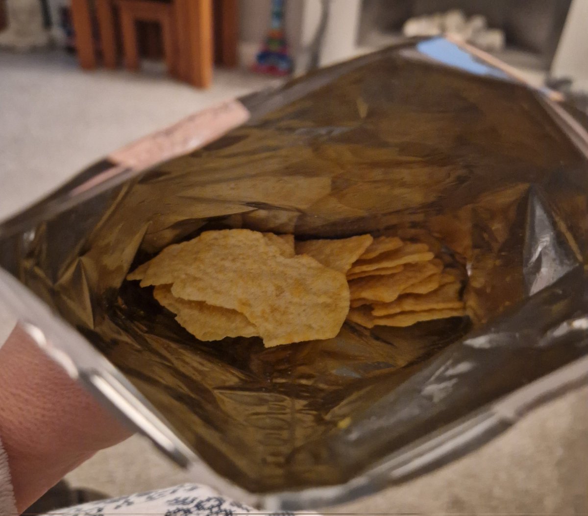 Boombagerty's tweet photo. @walkers_crisps why don't you make your crisp packets smaller if this is the amount of crisps in them? https://t.co/ig5M5FqFj4