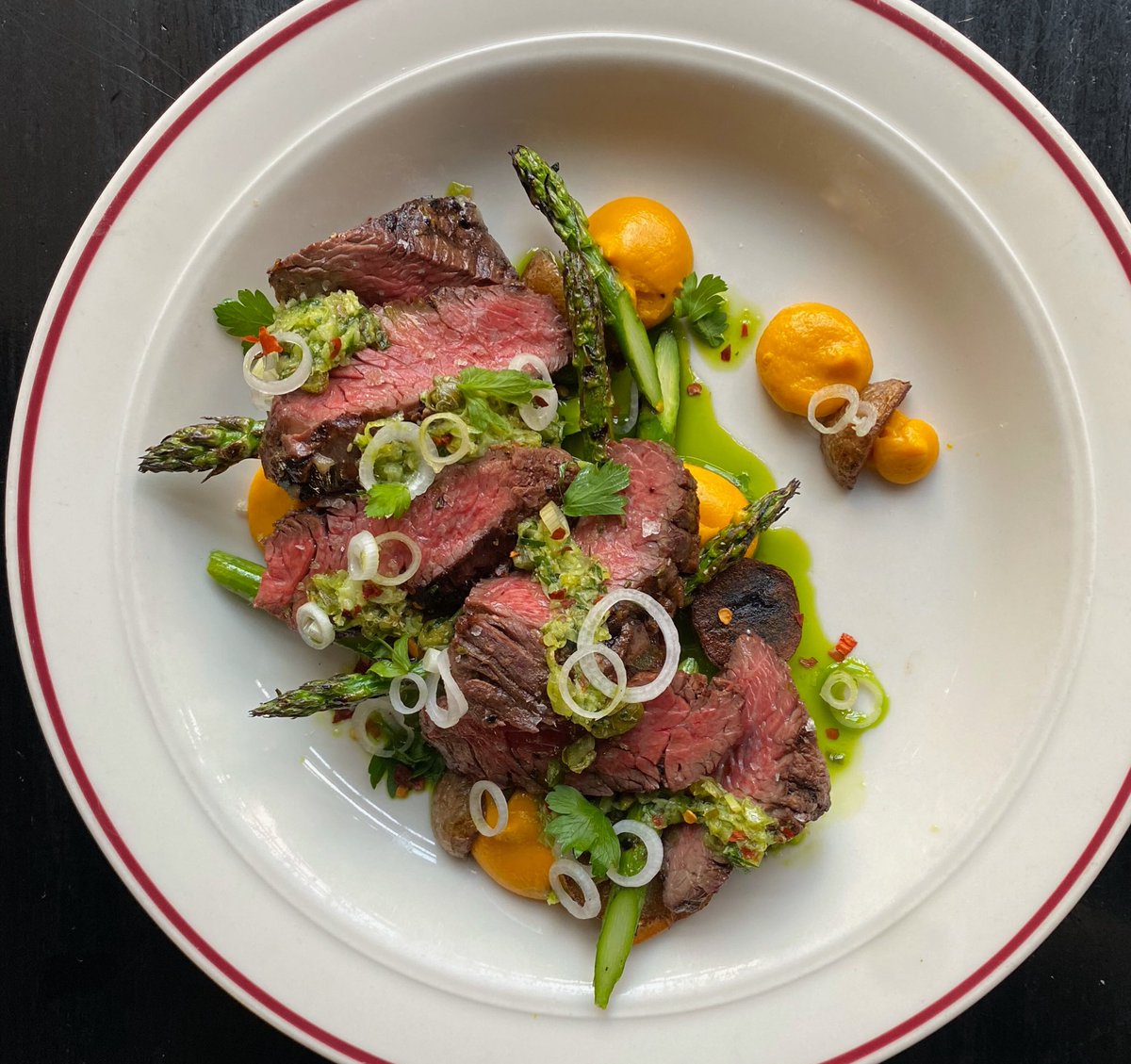 Grilled Hanger Steak with seared new potato, carrot purée, charred asparagus &amp; Spring onion salsa verde 🥩 budandmarilyns.com