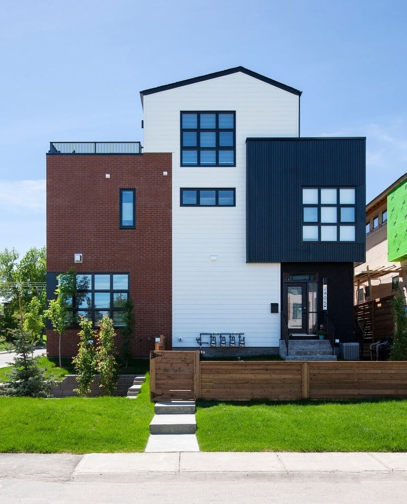 Sometimes our favourite facade isn't the front. Our Richmond 4 project is a four-unit rowhouse building a short walk from Calgary’s Marda Loop district. The front facade evokes a turn-of-the-century warehouse, which is great, but this north facade remind… instagr.am/p/CrUAju4OUr_/