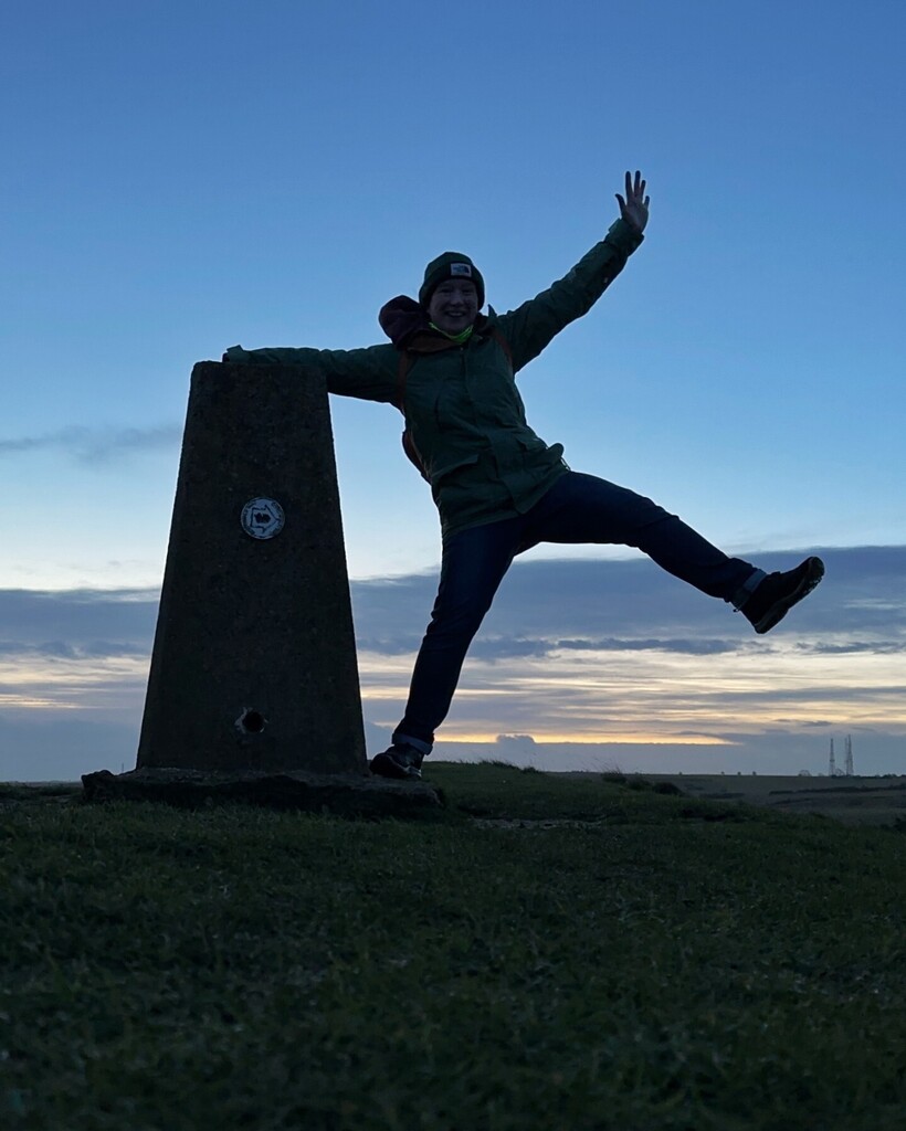 Splodz's tweet photo. It seems I don't have any sensible photos of me at a trig pillar - but hey, life is too short to be normal! 

Continuing to celebrate @ordnancesurvey's #TrigWeek by sharing some happy trig memories. This is me at sunrise on 1 January 2023, enjoying a mom… https://t.co/UD1uLRv2PM https://t.co/aZMyqdGHmu