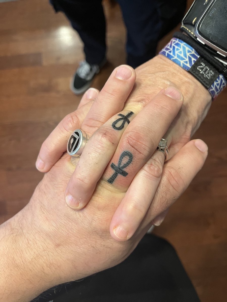 CDennisMoore's tweet photo. 27 years ago I met the love of my life when she commented on my Sandman shirt. We quickly bonded over Death. To celebrate our love, two nights ago we got matching ankh tattoos. I love you, Kara, with all my heart. Thank you ⁦@neilhimself⁩ for bringing us together. https://t.co/TN7iptukEY