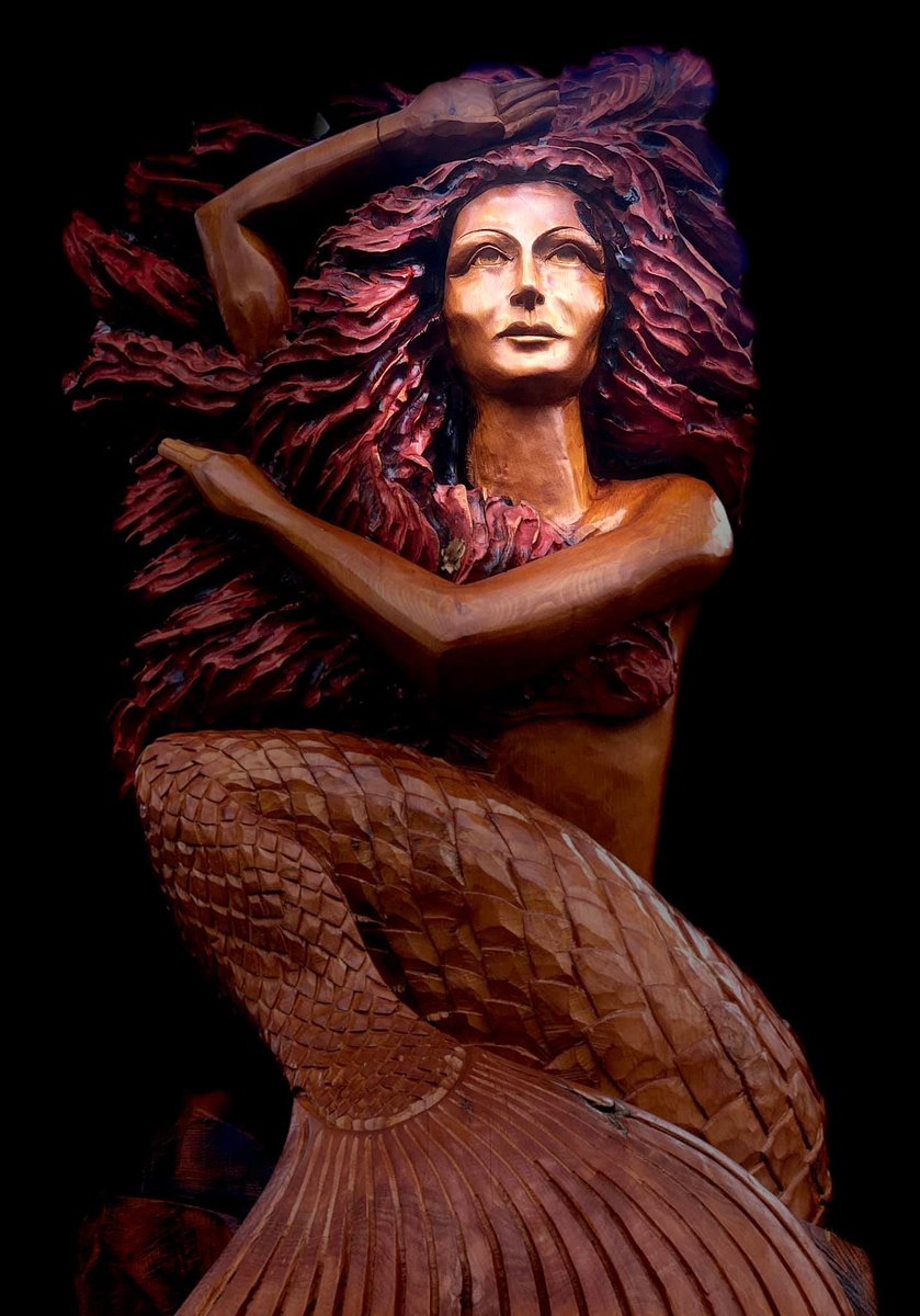KellyTavolassi's tweet image. The Merrow - Celtic mermaid. She has fiery red hair and a metallic bronze scaled tail. A commission for Fingal Co. Council. You can find her in Howth, Co. Dublin. She is carved from a Cedar of Lebanon butt.
