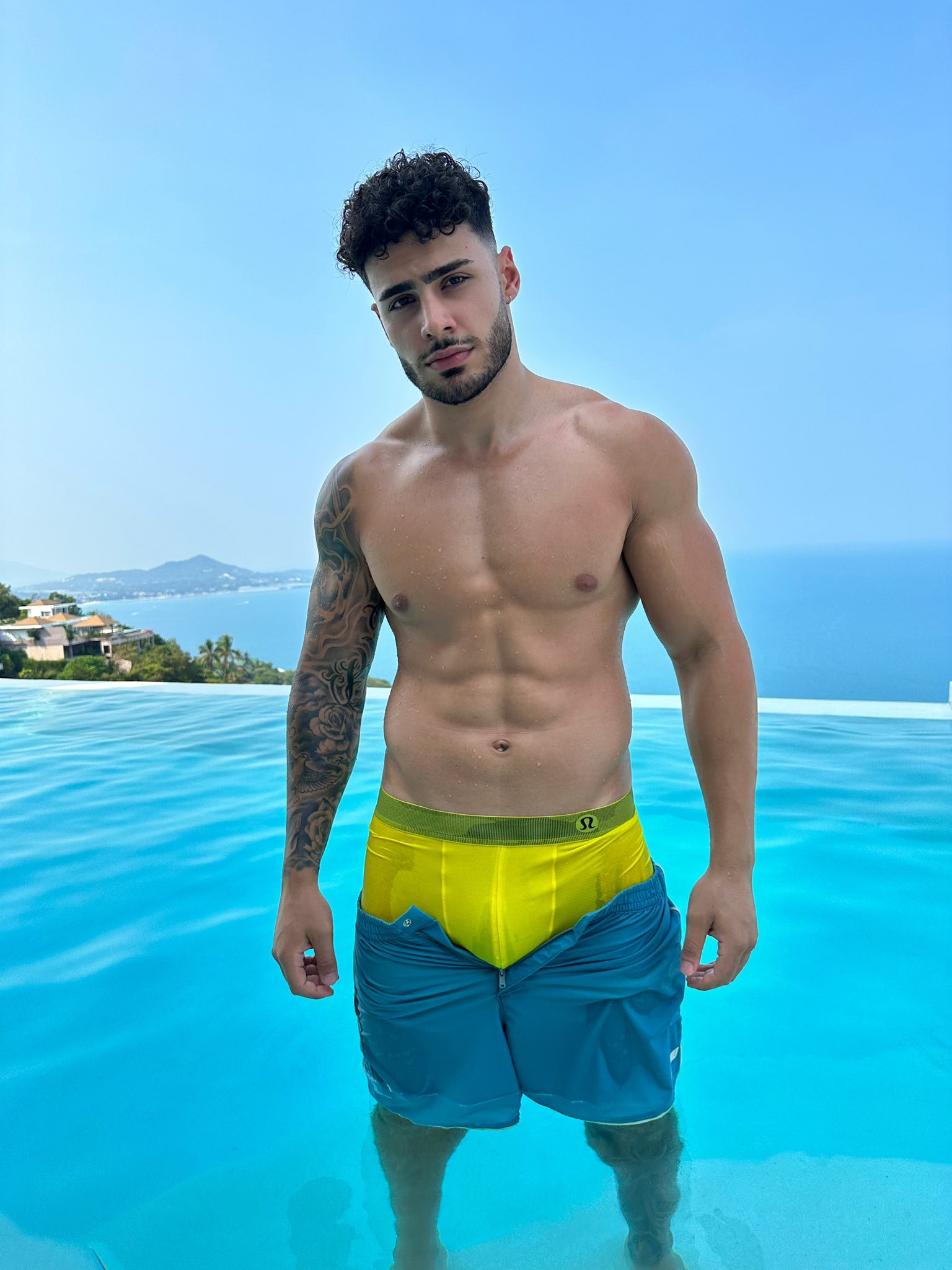 FitNarad shirtless on a beach