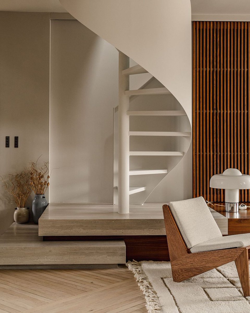 SpradSocial's tweet photo. We're enamored with this duplex renovation from @verocotrel. Sleek lines, striking millwork surrounding a wraparound staircase, and streamlined herringbone floors ground this space firmly in the realm of contemporary design. https://t.co/YLLrTgVxZS https://t.co/GcZAQ0hG75