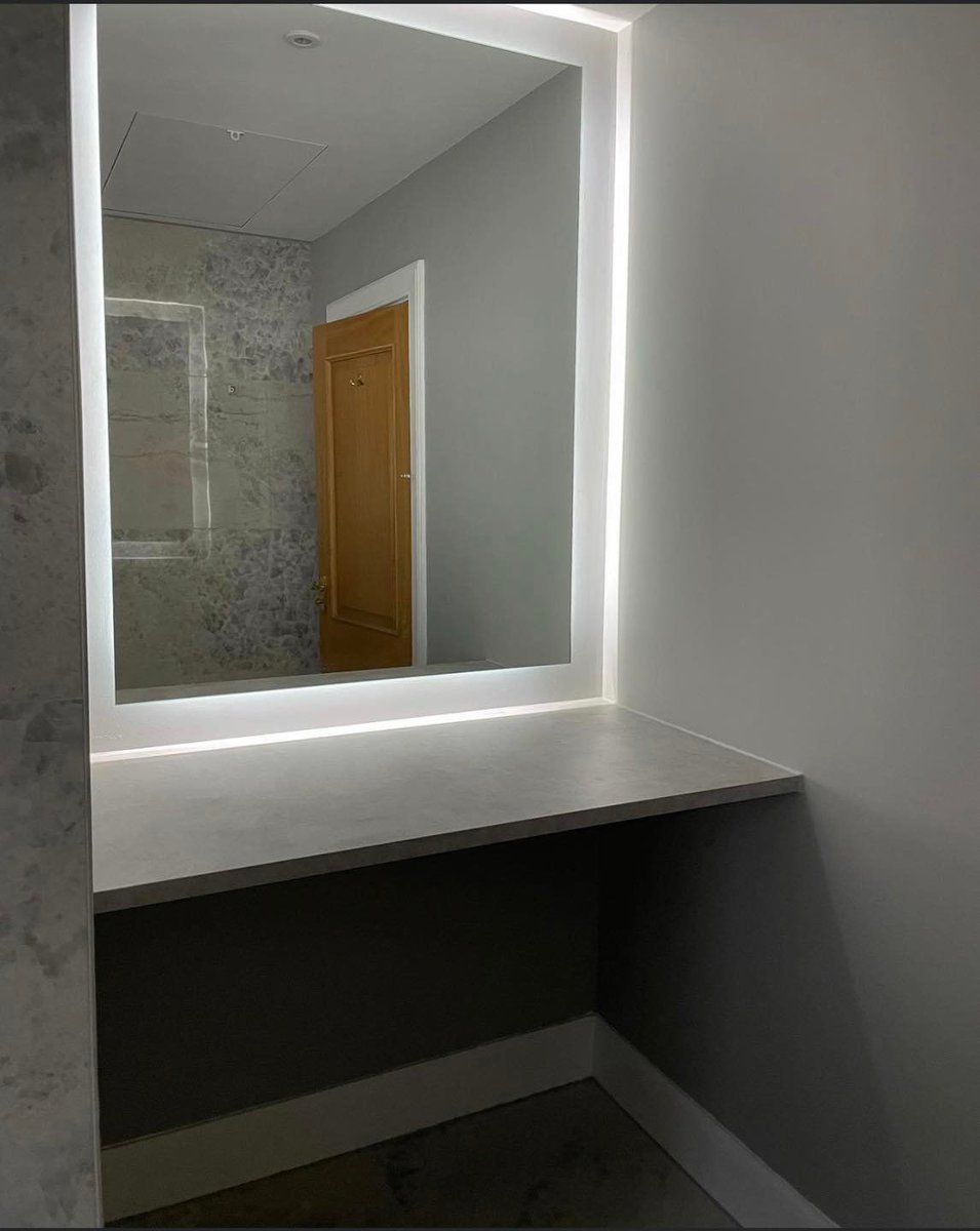 Mirror fitted in bathroom completed by Paul Finlay Ltd in East Lothian.